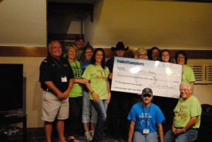 The crew presenting a check for $20,304 to Gift of Life House